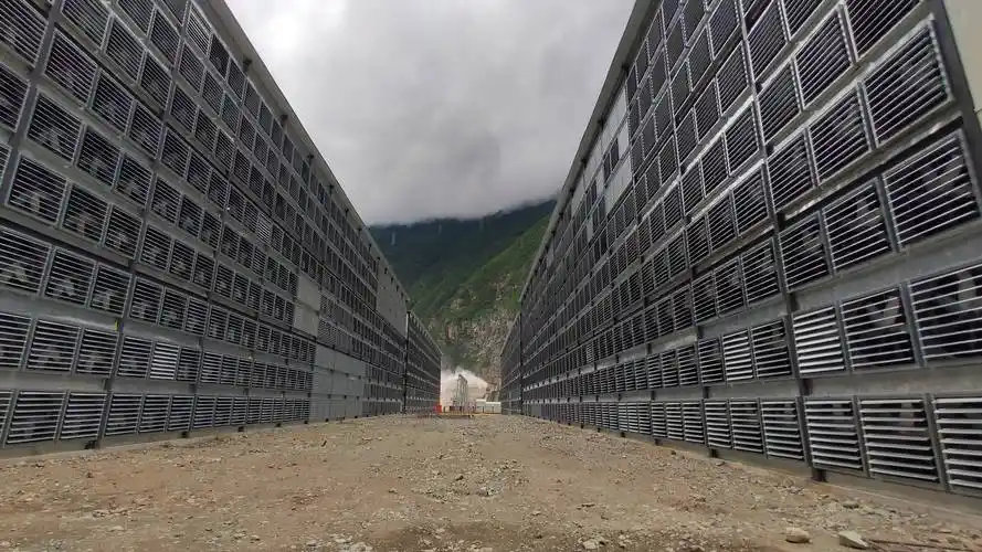 Overview of a mining farm filled with rows of mining rigs